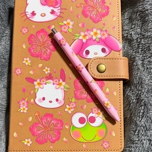 Tan and pink Sanrio journal with matching pen.